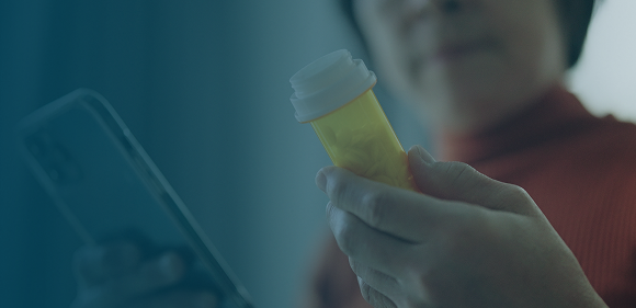 woman holding prescription bottle